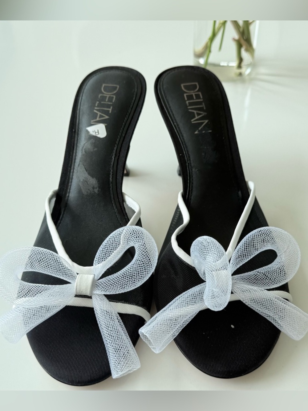 Deltan Black Slip-On Mules with White Bow Detail